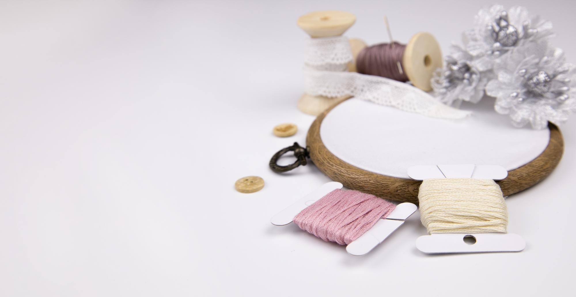 Studio workspace with threads and hoop